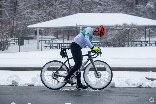A cyclist gears up for a wintery ride in Driscoll Park in Hyattsville.