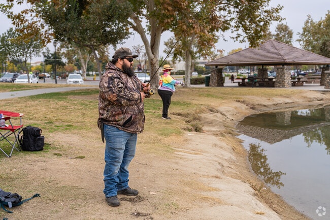 A couple from Terra Vista tries their luck at the River Walk lake.