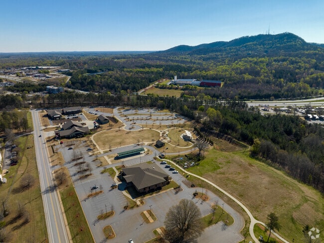 Trailblazer Park in Travelers Rest features a Farmers Market, Ampitheater, play space, and a view of Paris Mountain.