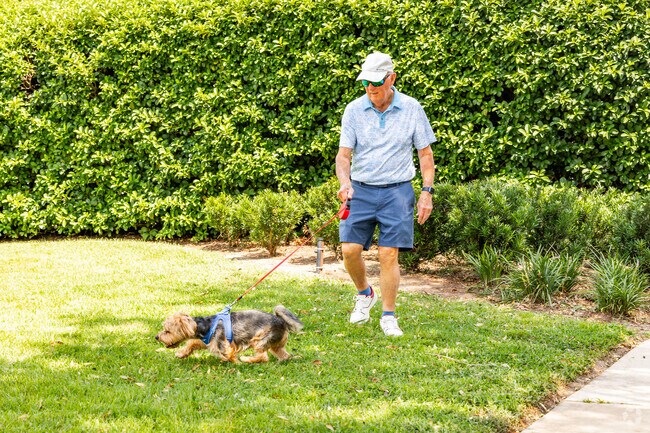 Residents of the Village of Saint Charles often walk their dogs through the neighborhood.