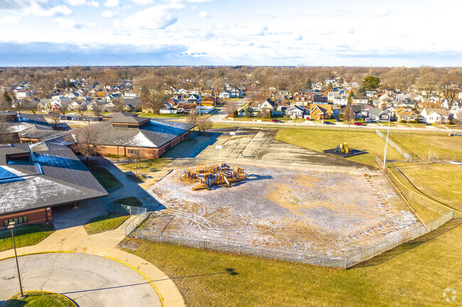 Thomas A Edison Elementary School features a large blacktop and playground.