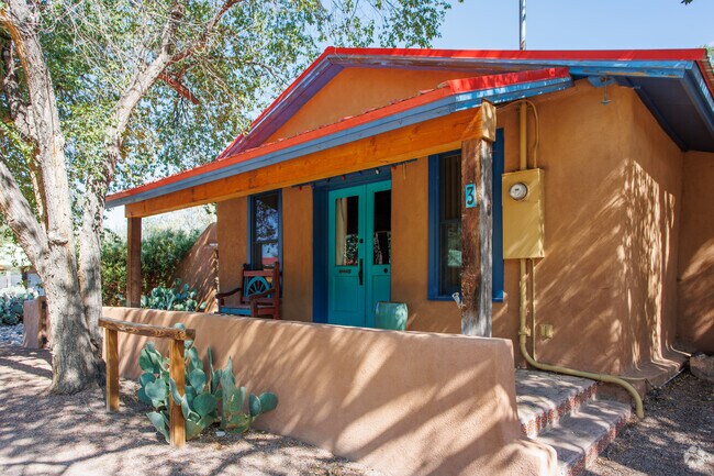 You will find historic buildings around Los Cerillos, most of them are still in use or homes.