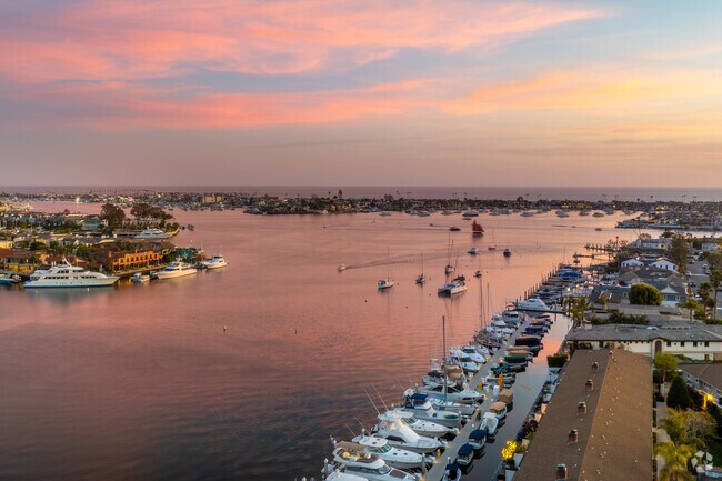 Living in the Castaways neighborhood offers breathtaking views of Newport Harbor, the Back Bay, and stunning Pacific Ocean sunsets from its elevated coastal vantage point.