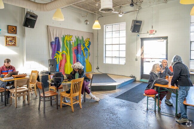 The small stage in Buvez offers local artists opportunites to perform in Newtown.