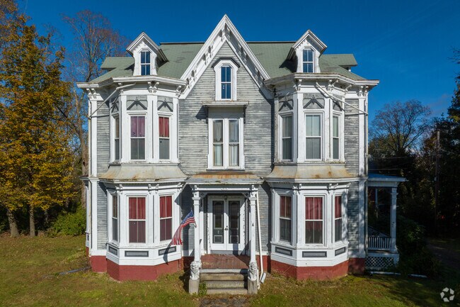 An historic Victorian overlooks the convergence of River, Post and Main Streets in Brookfield.