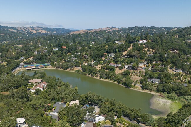 In Orinda Village homes are in the brushy forests along winding country roads with sharp turns.