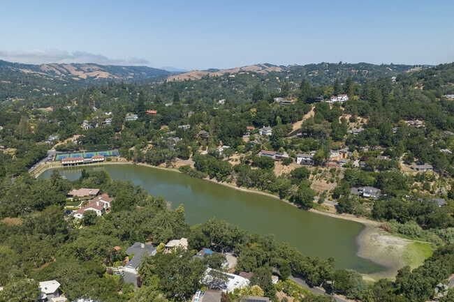 In Orinda Village homes are in the brushy forests along winding country roads with sharp turns.