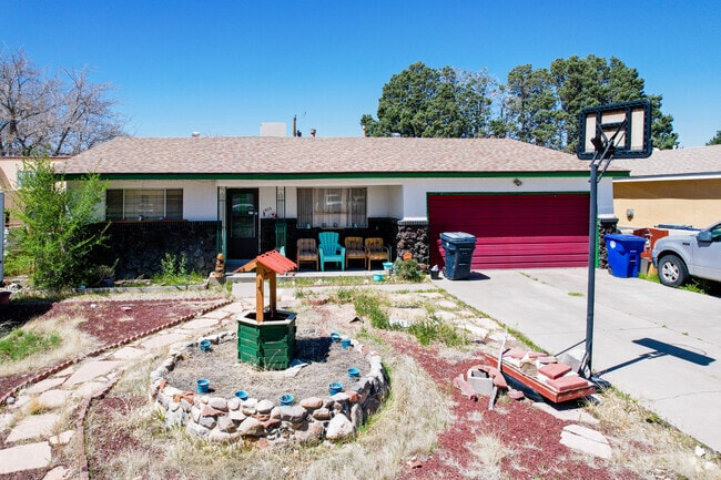 White Stucco and Stone Home with Yard Décor in Mesa Village