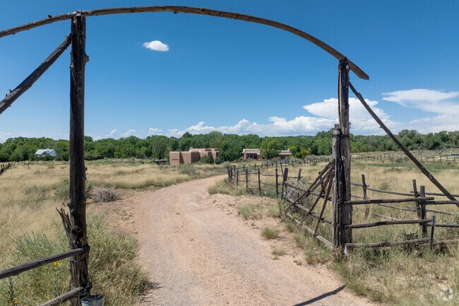 Most homes in Galisteo have large plots of land and rustic fences.