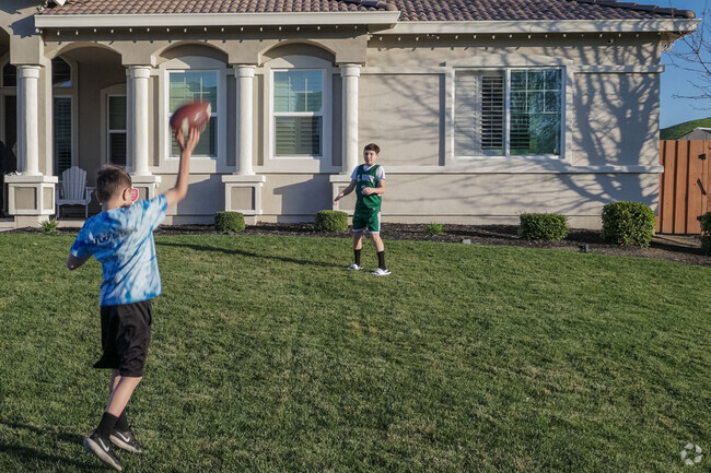 Home turf Kids' football game in a Meadowbrook front yard.