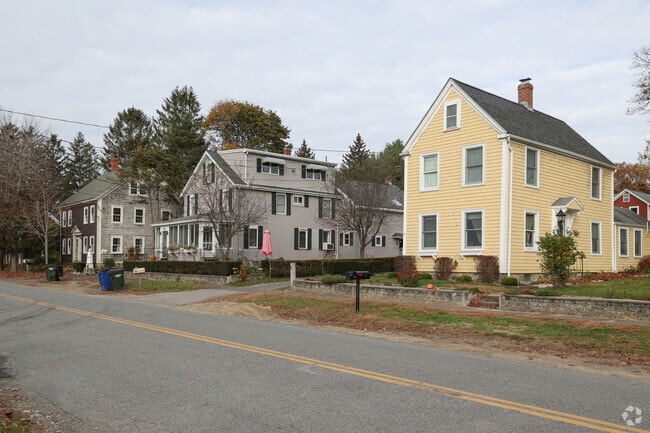 Large homes touch Railroad Ave in Rowley.