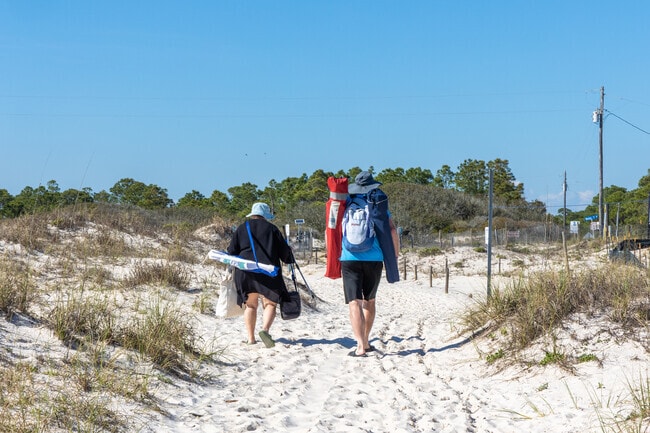 Gulf Highlands locals enjoy the salty air as they make the sandy trek to the beach and back.