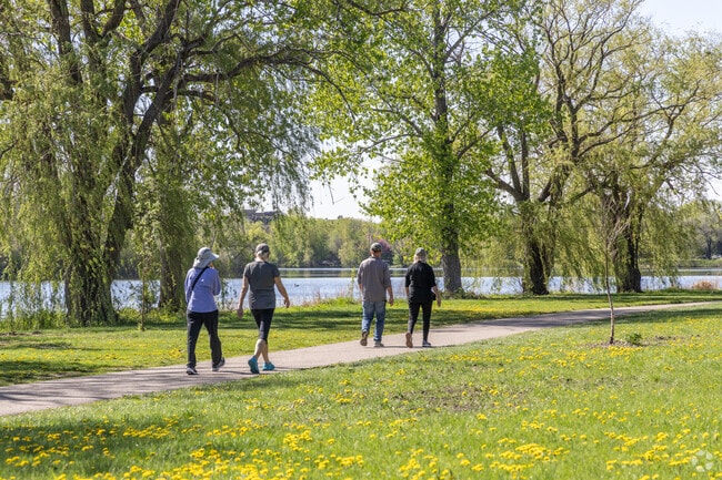 On a sunny day, the lake in Kenwood draws residents out to enjoy the scenery and fresh air.