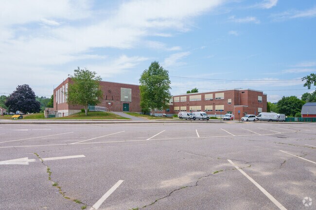 There's a parking lot sitting behind the Newfound Memorial Middle School.