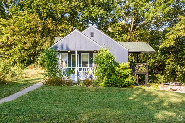Whimsical bungalows sit shrouded in greenery in the Coachlight Square neighborhood.