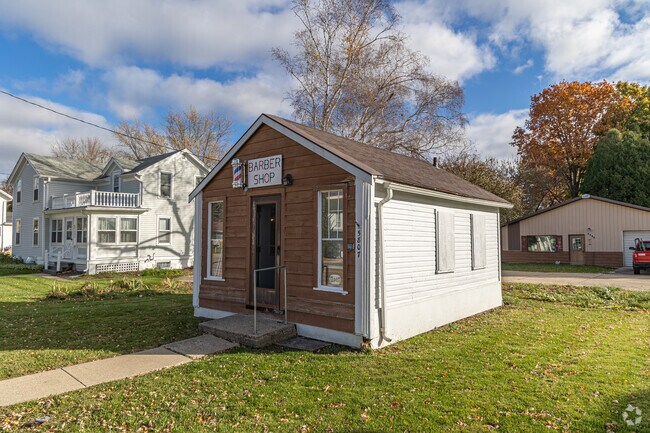 A cute barber shop located in a residential area of McFarland.