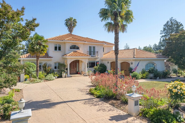 Spanish inspired home gives the neighborhood a pop of color in Los Gatos.