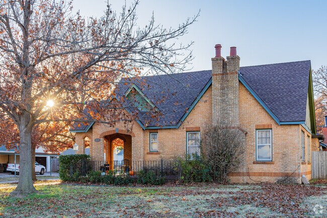 The brick craftsman style home shines in the Chickasha Neighborhood.