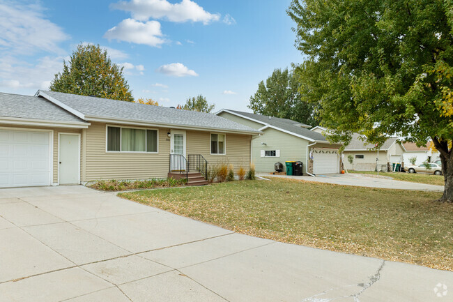 Ranch homes with neat yards sit behind mature tree's in the established Riverside neighborhood.