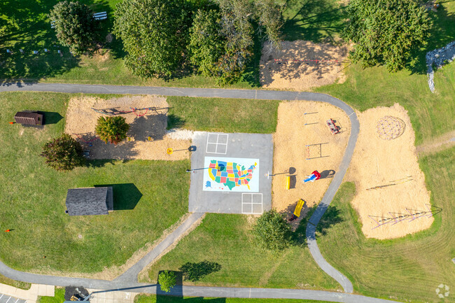 Ferguson Township Elementary School has an outdoor play area and blacktop.