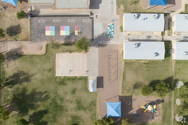 The campus at Longfellow Elementary in Mesa includes multiple play areas.