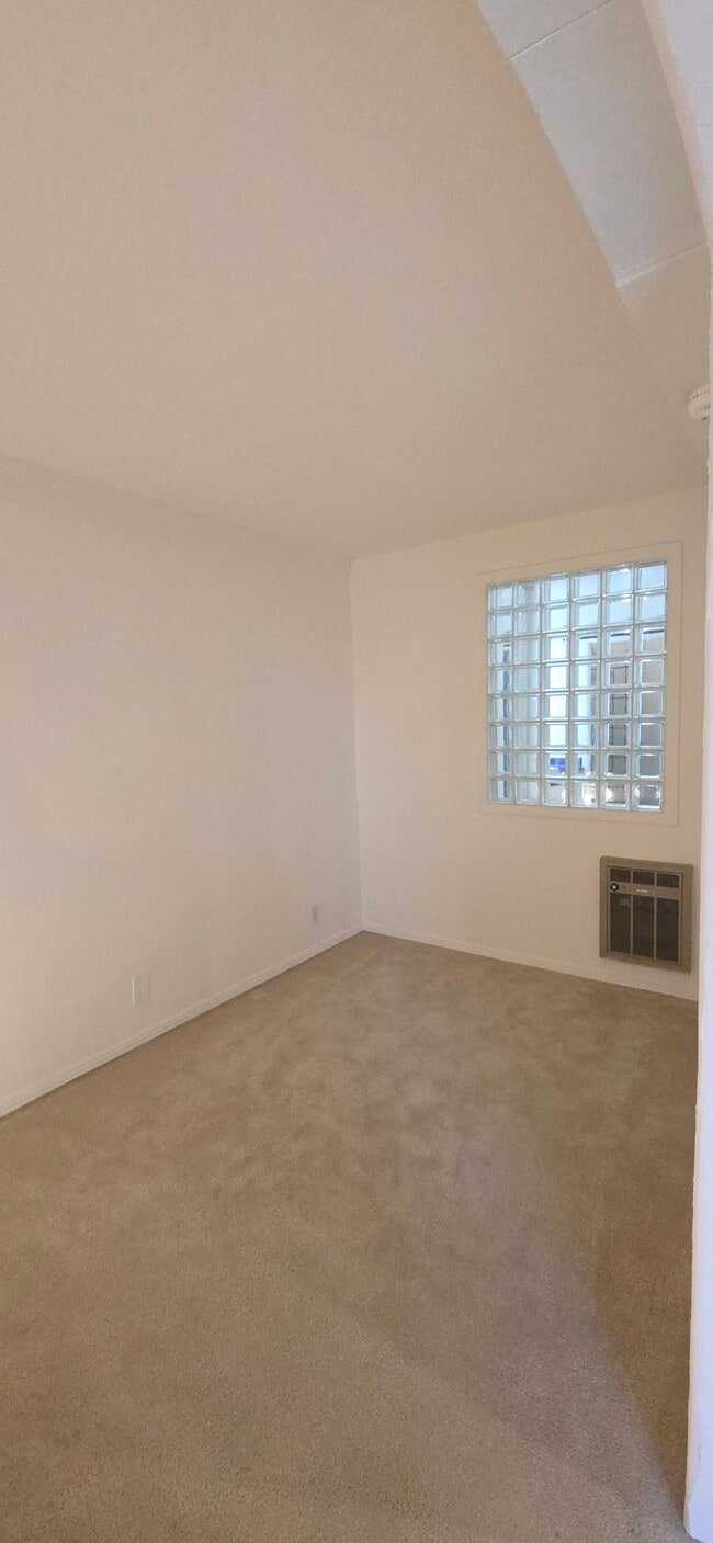 Bedroom / Glass brick window to closet