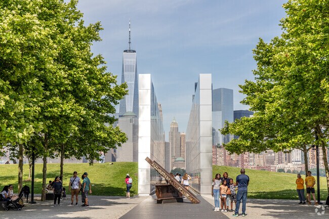 Liberty State Park features a 9/11 memorial with the NYC skyline in the background.