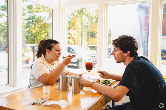 This couple enjoys a healthy lunch at Misty's Plant Based Food in Central Monroe.
