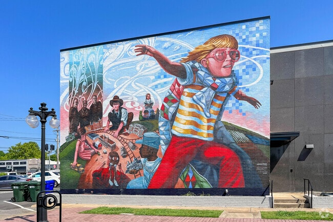The vibrant “Aurora Rising” mural brings color and creativity to the streets of Downtown Conway, celebrating local art and culture.