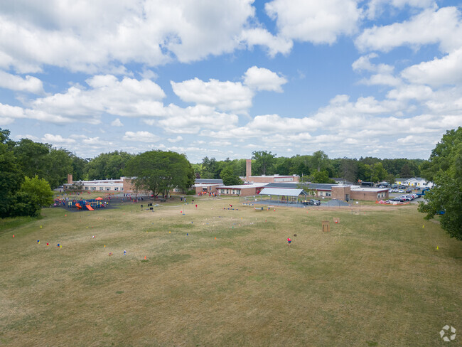Westmere Elementary School has a long and open field where many students can play together.