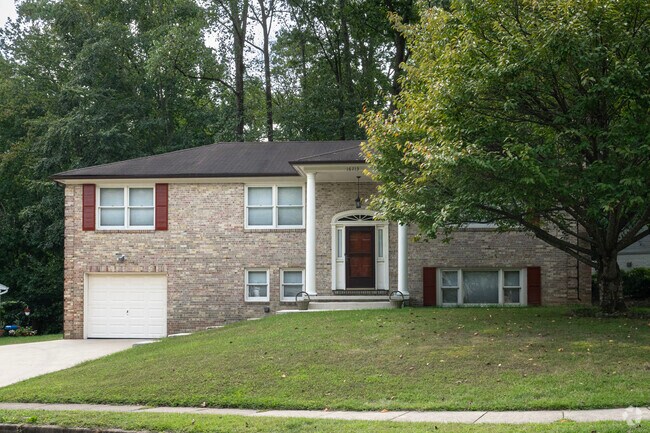Classic elegance of brick single-family home on Edgewood Dr in Four Seasons.