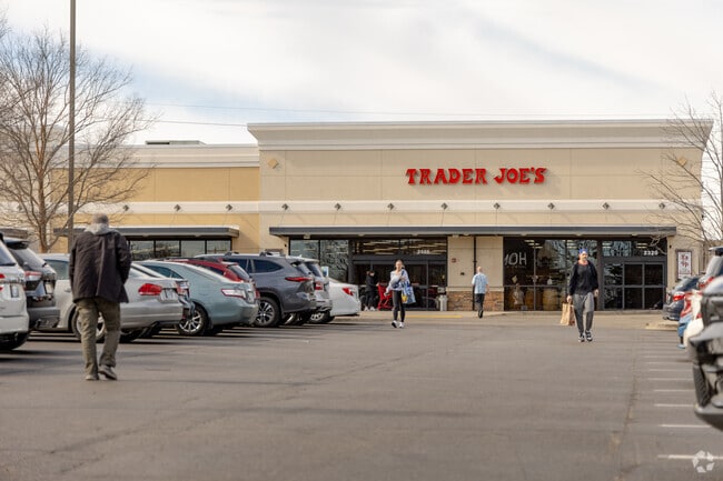 Shoppers in Zandale browse gourmet cheeses and fine wines at Trader Joe's.