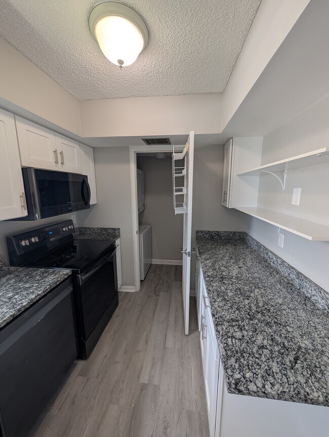 Laundry room attached to kitchen