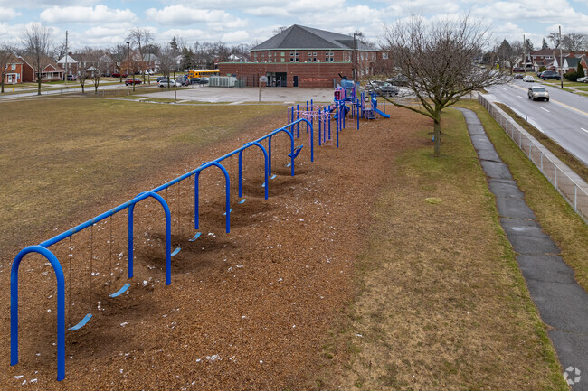 Swings and playground for students attending Iris Becker Elementary School.