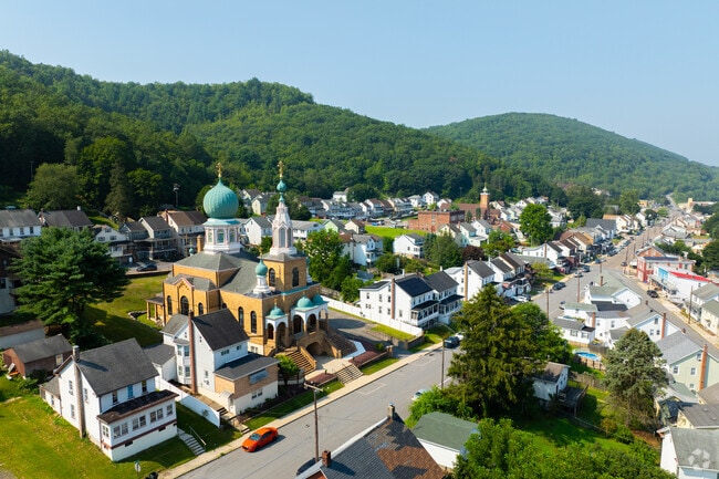 An aerial shows a church and rows of homes in Nesquehoning.