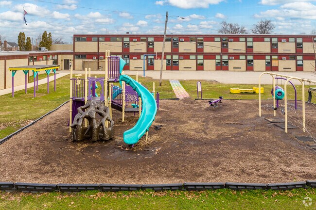 Evans Elementary School lets kids play on the jungle gym during recess.