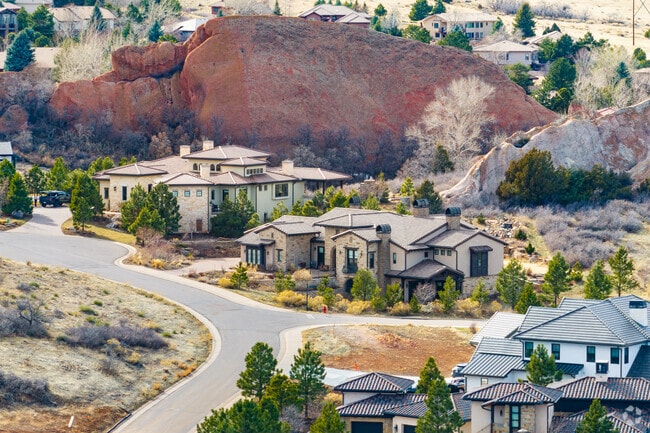 Mountain mansions line private streets along the foothills of Roxborough Park.