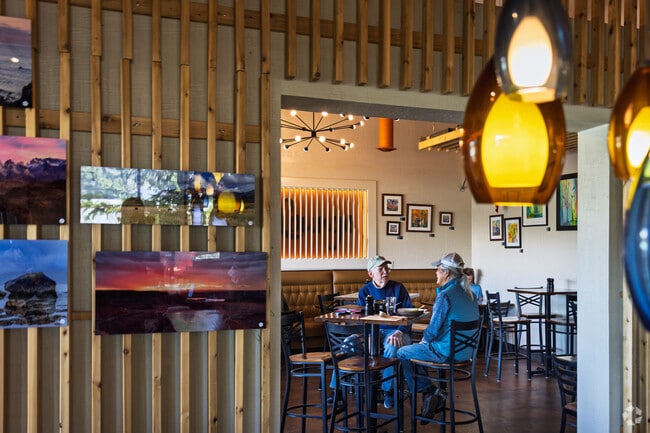 Sit down and enjoy a fresh sandwich at Evergreen Bread & Cocktail Lounge near North Central Evergreen.