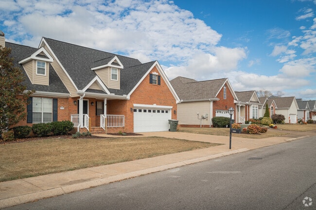 Brick single family homes with attached garages can be found throughout Hamilton Place.