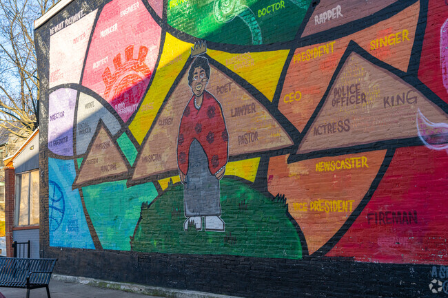 The mural at 4th & Rodney St Tot Lot encourages kids to follow their dreams.