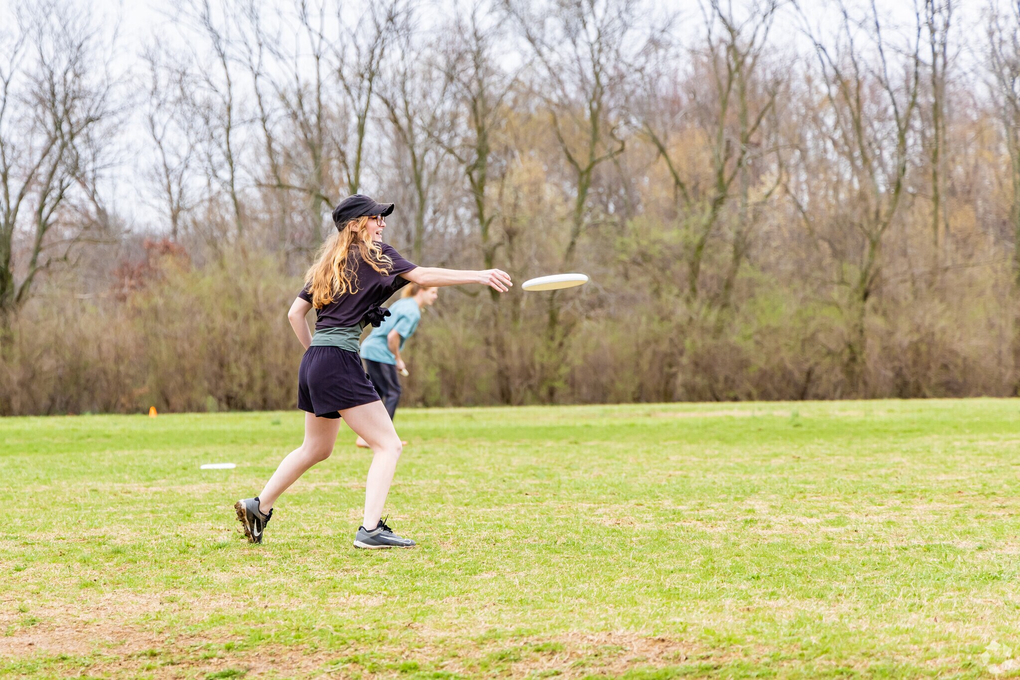 Teenagers practice their frisbee skills at Shillito Park.