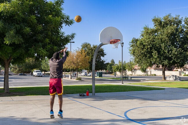 A resident of Parkview Estates enjoys his morning outing to North Meadows Park.