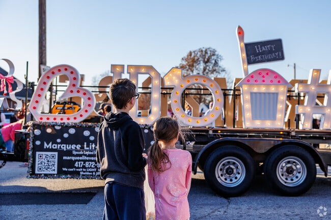 Local businesses promote with floats at Christmas on Main Street.