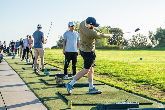 Yorba Linda residents practice their swings at Black Gold Golf Club open 7 days a week.