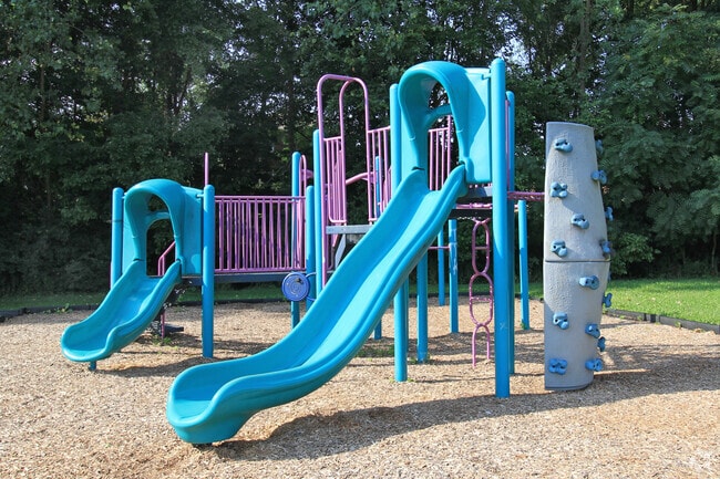 Children can climb the mini rock wall at Mallonn Memorial Park's playground.