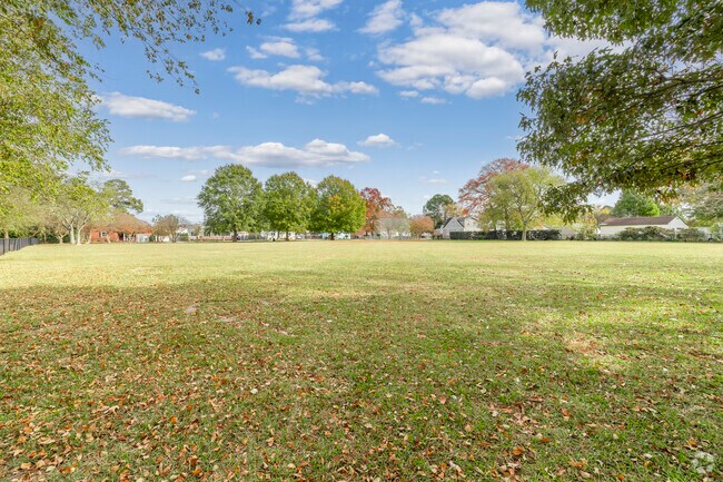 Unwind in the expansive playground fields, a haven for community gatherings in Foxhall.