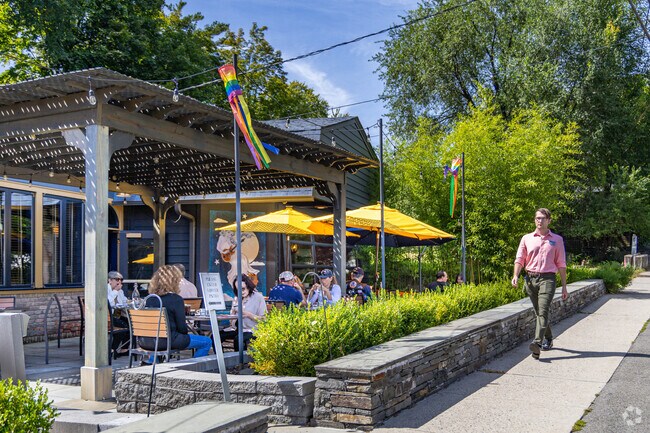 Locals enjoy summer strolls as they walk down main street in vWest Hurley, NY.