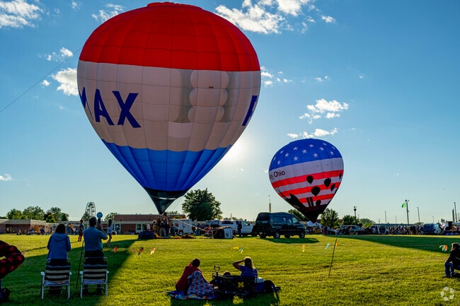 Families scope out cozy spots along the launch field at the  Michigan Challenge Balloonfest.
