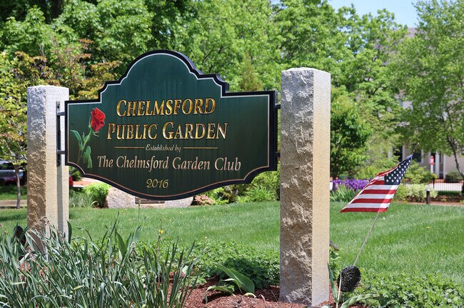 The Chelmsford Public Gardens greet visitors with vibrant, welcoming beauty at the entrance to the Pine Hill neighborhood, setting a charming and colorful tone for the community beyond.