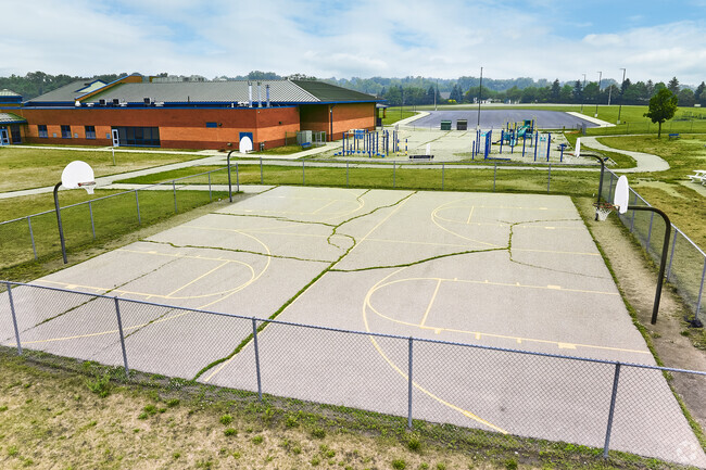 The basketball courts behind Woodland Meadows are part of the Saline Corona Athletic Complex.